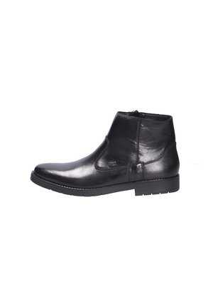 Bottine noire en cuir avec fermeture éclair latérale, talon bas et semelle en caoutchouc texturée, vue de profil sur un fond blanc uni.