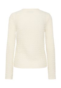 Haut en maille texturée, crème, à manches longues avec un motif ondulé subtil, vu de dos.