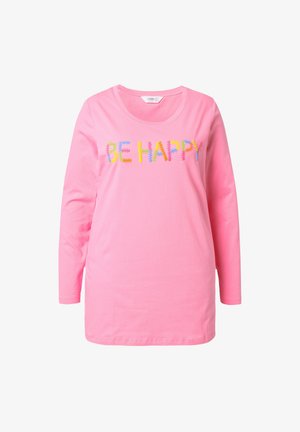 Różowa bluzka z długim rękawem i okrągłym dekoltem, z wielokolorowym haftowanym napisem "BĄDŹ SZCZĘŚLIWY" z przodu. Wykonana z miękkiego materiału bawełnianego.
