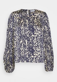 Blusa a maniche lunghe con motivo astratto a pois blu navy e beige, scollatura rotonda e polsini arricciati in elastico.