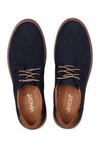 Navy blue perforated shoes with beige laces, round toe, and brown sole. Textured insole visible with brand logo. Rubber outsole.