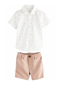 White short-sleeve button-up shirt with small brown leaf patterns paired with beige shorts featuring a button and belt loops.