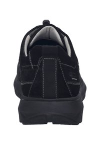 Black suede sneaker featuring a textured upper, padded collar, pull tab, and contrasting white stitching on a thick black sole.