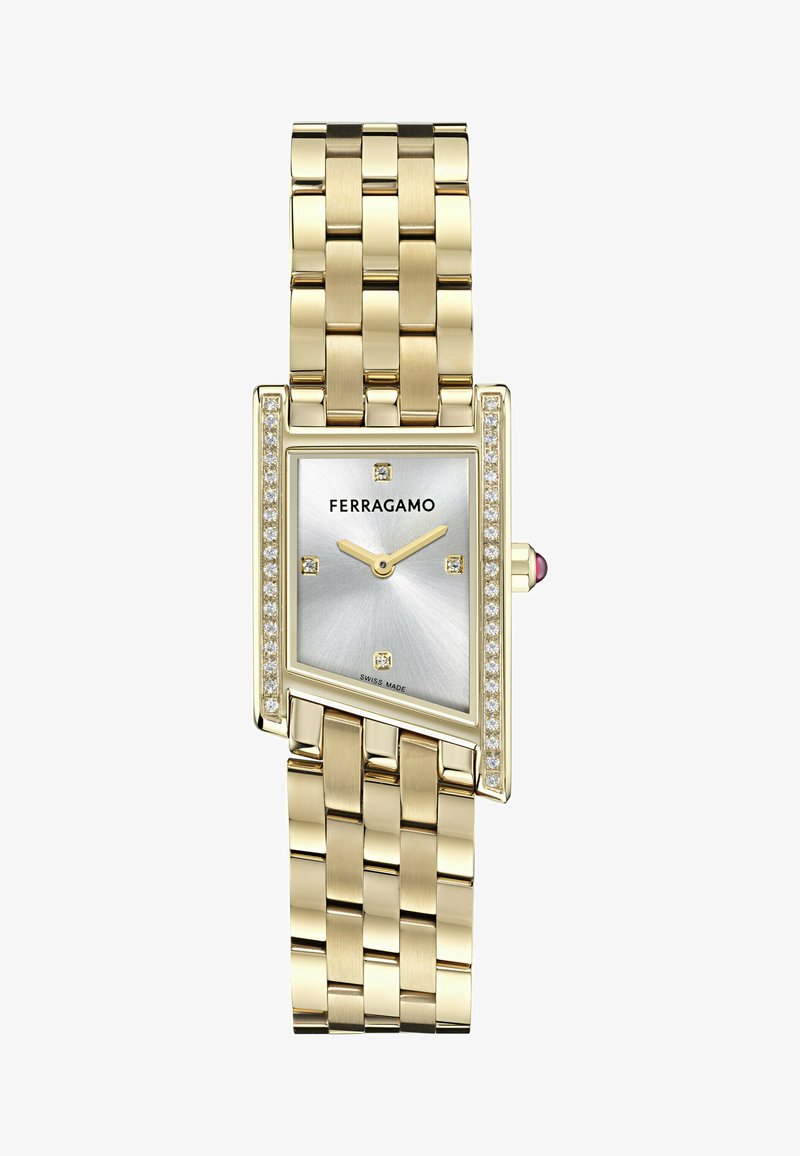 Zelta toņa taisnstūra pulksteņi ar sudraba saules zibens ciparnīcu, dimantu akcentiem un austu metāla siksniņu. Šveicē ražots, ar redzamu logo.