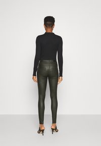 JDY NEWTHUNDER HIGH NOOS - Calças - forest night