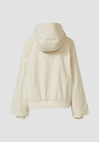 Krémová mikina s kapucňou a dlhými rukávmi, s elastickým pásom, pohľad zozadu na jednoliatom svetlom pozadí.