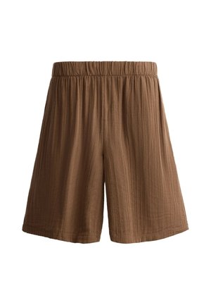 Short marron, coupe ample avec une taille élastique et un motif subtil en tissu texturé, présenté sur un fond blanc uni.