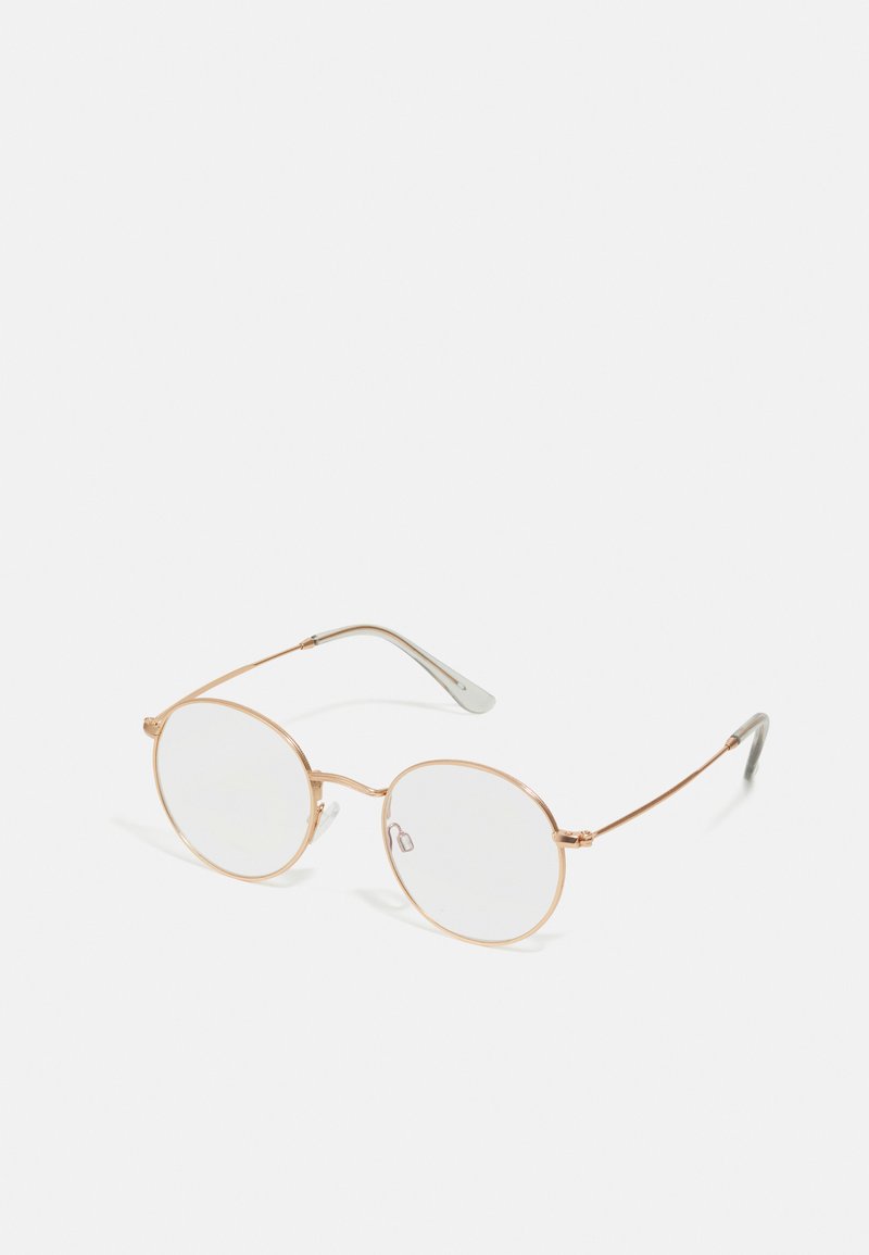 Round eyeglasses with a thin gold metal frame, clear lenses, and gray textured temple arms. Minimalist design with subtle hardware accents.