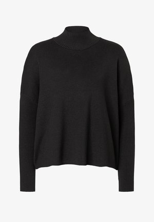 Zwarte gebreide coltrui met een ontspannen pasvorm, voorzien van geribbelde details op de mouwen en het lichaam voor textuur en warmte.