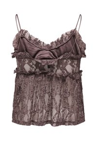 Caraco en dentelle mauve à fines bretelles avec motifs floraux et doublure satinée dans la partie haute, plié à plat sur fond blanc.
