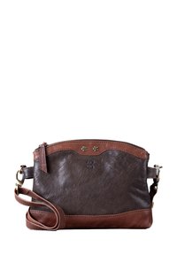 Brown leather handbag with a smooth texture, accented by a lighter brown bottom and top trim, featuring small decorative studs and a zip closure.