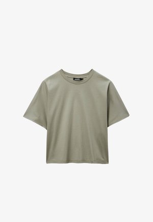 T-shirt en coton vert olive clair à manches courtes et col rond, coupe ample, présenté sur un fond blanc.