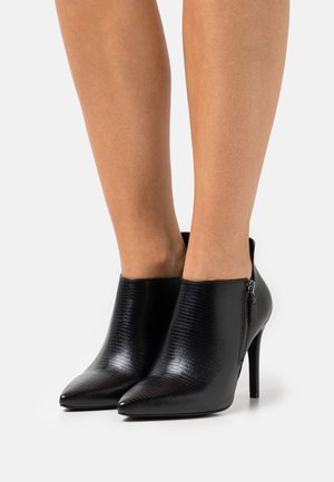 Minelli, Enkellaarsjes met hoge hak - black