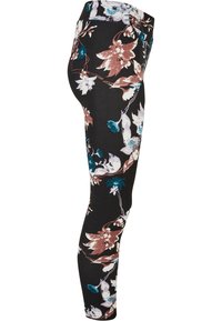 Leggings fleuris en tissu noir avec des fleurs multicolores en bleu, rose et blanc. Coupe slim avec une taille élastique.