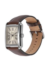 Montre Fossil rectangulaire avec un boîtier en acier inoxydable et un bracelet en cuir marron. Le cadran beige présente des chiffres romains et des détails de sous-cadran.