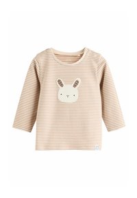 Beige stribet langærmet skjorte med lys bunny-applikation på forsiden, trykknapper på skulderen og lille bunny-logo nederst til venstre.