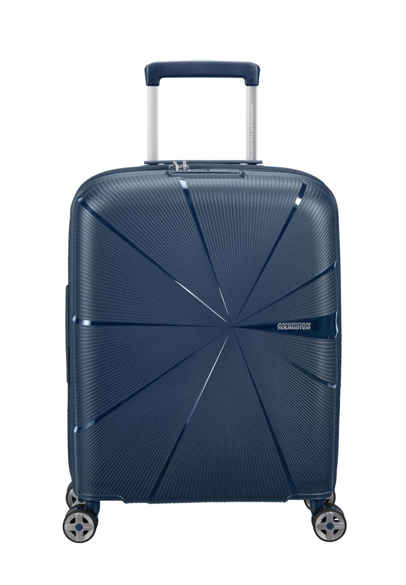 Valigia rigida blu navy con un design testurizzato, dotata di manico telescopico e quattro ruote girevoli per una facile manovrabilità.