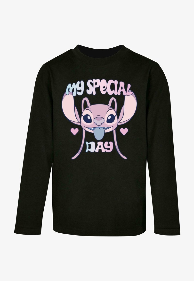 T-shirt noir à manches longues avec un personnage de dessin animé aux grandes oreilles et une expression espiègle. Le texte indique "MA JOURNÉE SPÉCIALE" dans une police colorée.