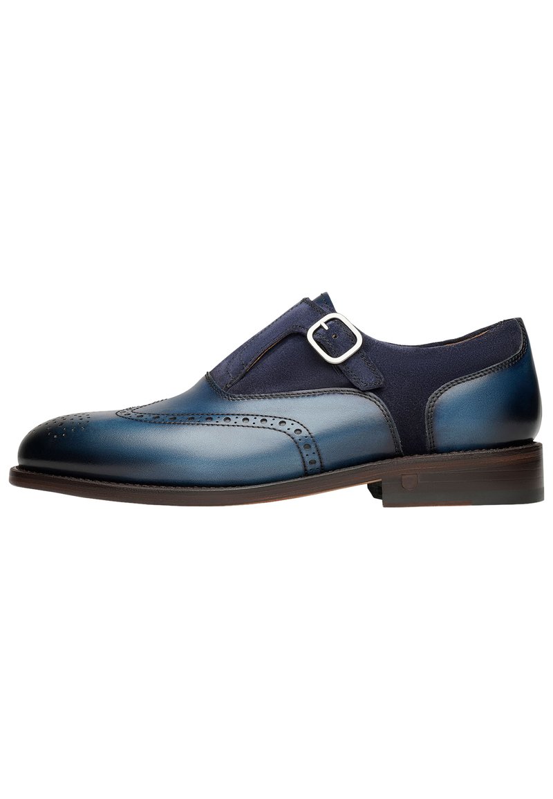 Navy Leder Oxford-Schuh mit einem Wildleder-Einsatz, dekorativen Perforationen und einer Metall-Schließe. Verfügt über eine runde Zehenpartie und einen gestapelten Absatz.