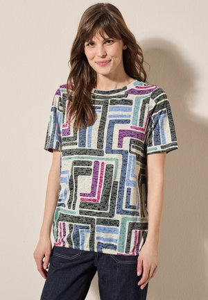 T-shirt à manches courtes avec un motif géométrique dans des nuances de violet, bleu, noir et crème. Fabriqué à partir d'un tissu doux et texturé. Encolure ronde.