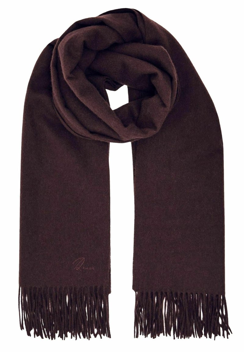 Brūns šalle, izgatavota no mīkstas vilnas, ar teksturētu materiālu, gludu virsmu un fringētām malām, sarullēta relaksētā cilpā.