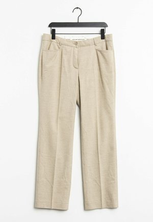 Beige skräddarsydda byxor med platt framstycke, två sidfickor, lätt veck och dragkedja med knappstängning. Gjorda av ett lätt tyg.