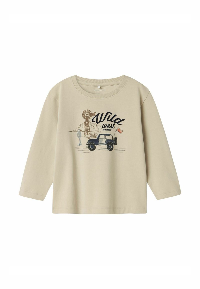 Beige pitkähihaisessa paidassa on edessä tuulivoimala, vuoria ja ajoneuvo, jossa on mustalla kirjoitettu "Wild West" -teksti. Materiaali on puuvillaa ja malli on rento.