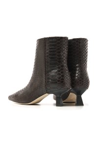 Brown, snake-patterned ankle boots with pointed toes and a short, block heel. Glossy texture enhances the unique design.