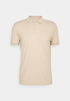 Beige gerippte Polo-Shirt mit Kragen und einer drei-Knopf-Leiste. Der Stoff erscheint weich mit einer strukturierten Oberfläche. Kurzärmlig.