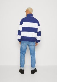 Tommy Jeans TIMELESS - Vindjakke - pilot blue/multi
