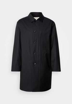 Manteau noir avec fermeture boutonnée, col pointu et manches longues. Confectionné en tissu lisse, il présente six boutons et une coupe droite.