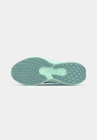 Light teal athletic shoe sole with a textured grip pattern; features a central AIR branding; smooth edges and curved heel.