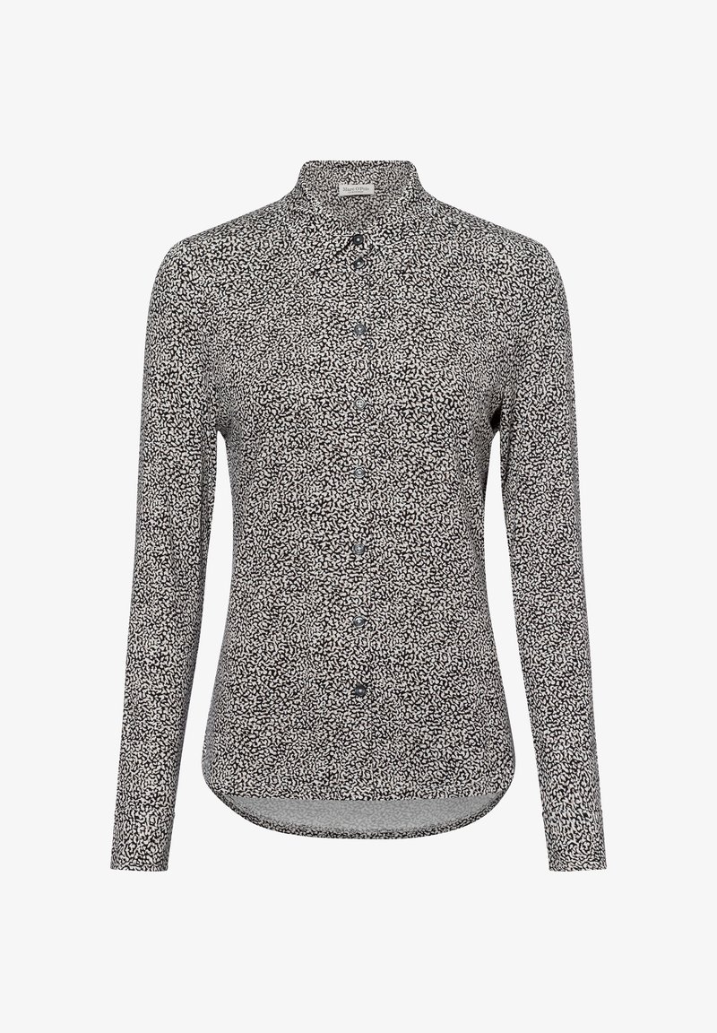 Long-sleeve shirt in black and white patterned fabric with a collared neckline and front button closure. Smooth texture; curved hemline.