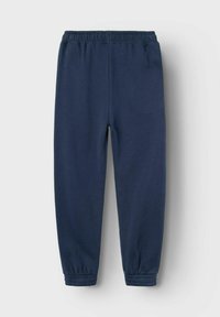 Marineblaue Jogginghosen aus weichem Strickstoff, mit elastischem Bund und Bündchen, glatter Textur und ohne sichtbare Muster.