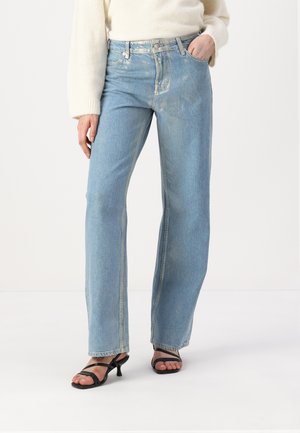 Light blue wide-leg jeans made of denim with faded accents, featuring a classic button fly, five pockets, and side stitching details.