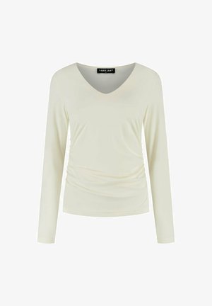 Lichtcrème top met lange mouwen en een V-hals, geplooide zijdetails, een soepele structuur en een label met de tekst "LADY DAY."