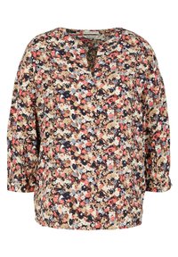 Blouse florale avec un décolleté en V, des manches trois-quarts et une coupe ample. Présente un motif multicolore sur un fond beige clair.