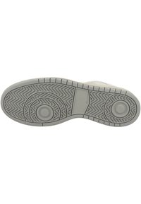 Light grey rubber shoe sole with herringbone and circular tread patterns. Features a smooth, textured surface and reinforced edges.