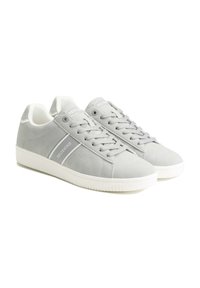 Gray suede sneakers with white accents, featuring textured laces, a rubber sole, and a side logo stripe. Rounded toe design.