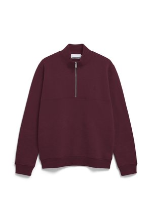 Bordeaux sweatshirt van zachte stof, met een hoge kraag en een korte rits aan de voorkant. Het ontwerp heeft een opvallende horizontale naad-details.
