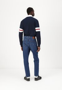 Tommy Jeans ISAAC - Relaxed fit jeans - denim dark