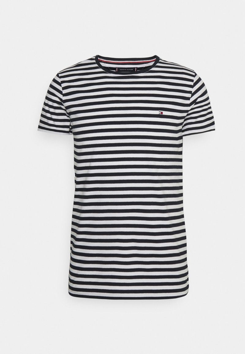 Černobíle pruhované tričko s kulatým výstřihem a krátkým rukávem. Na levé hrudi je malé logo. Vyrobeno z měkké tkaniny.