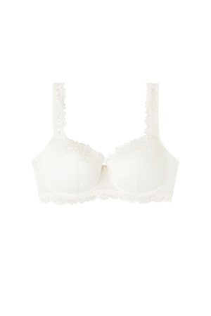 Reggiseno in pizzo bianco con ferretto, spalline in pizzo regolabili e bordi smerlati lungo le coppe e la fascia.