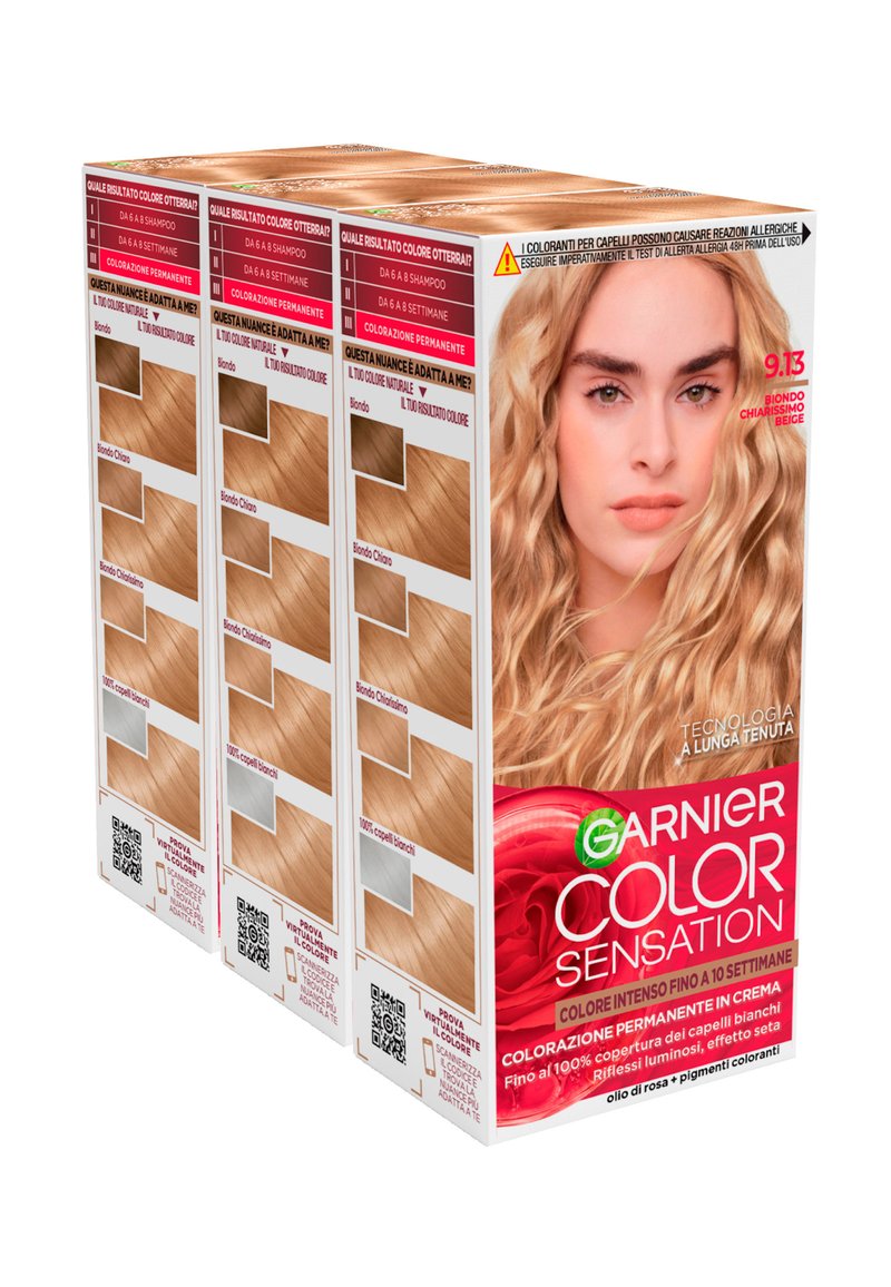 Il packaging della tintura per capelli Garnier Color Sensation presenta diverse scatole con campioni di tonalità biondo chiaro, un marchio ben visibile e accenti rossi audaci.