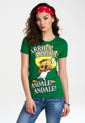 Green cotton t-shirt featuring a cartoon character with a yellow sombrero and text "ARRIBA! ANDALE!" in bold, black and white fonts.