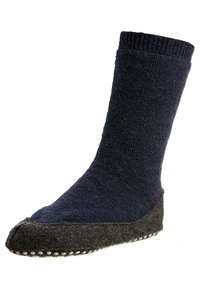 Strikket sokk med en mørkeblå kropp og en grå filtet bunn, med hvite prikkete grep langs sålen for bedre grep.