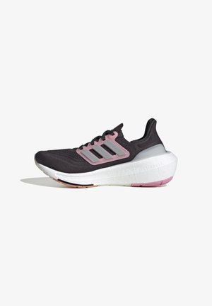 Black athletic shoe with pink accents, lightweight mesh upper, distinct three-stripe design, cushioned midsole, and textured rubber outsole.