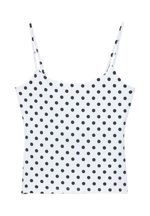 Bijeli top na bretele s tankim naramenicama i uzorkom crnih točkica koje ravnomjerno prekrivaju tkaninu.