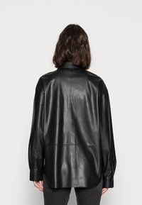 Calvin Klein Jeans Giacca in similpelle - black