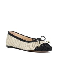 Braided flat shoe with a cream body and black accents. Features a rounded toe, a bow detail at the front, and a small, flat sole.